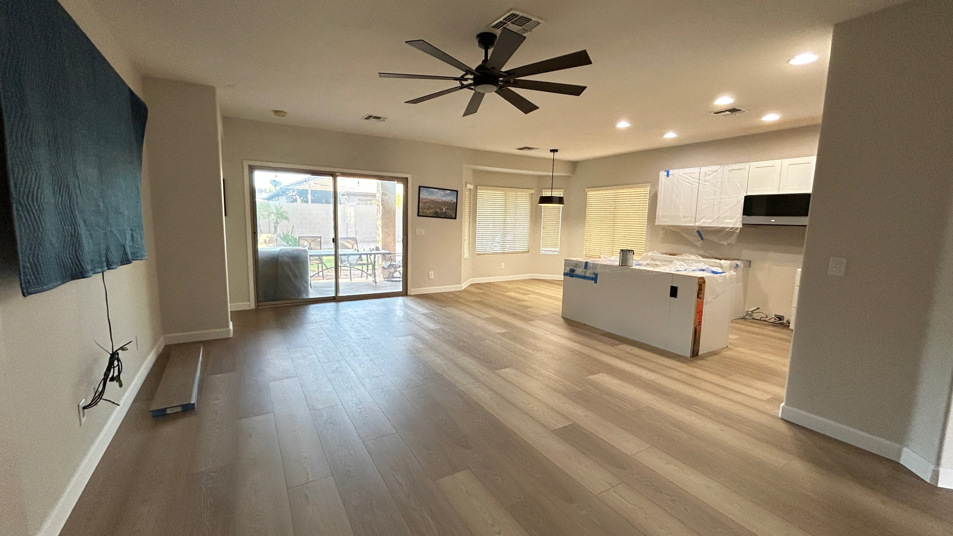 After: Bare concrete → Wide-plank LVP in Phoenix, AZ