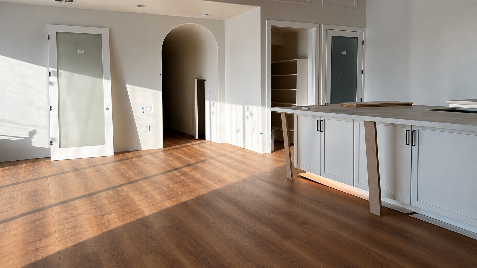 Warm wood-look flooring installed by HPM Flooring in a bright Arizona residence