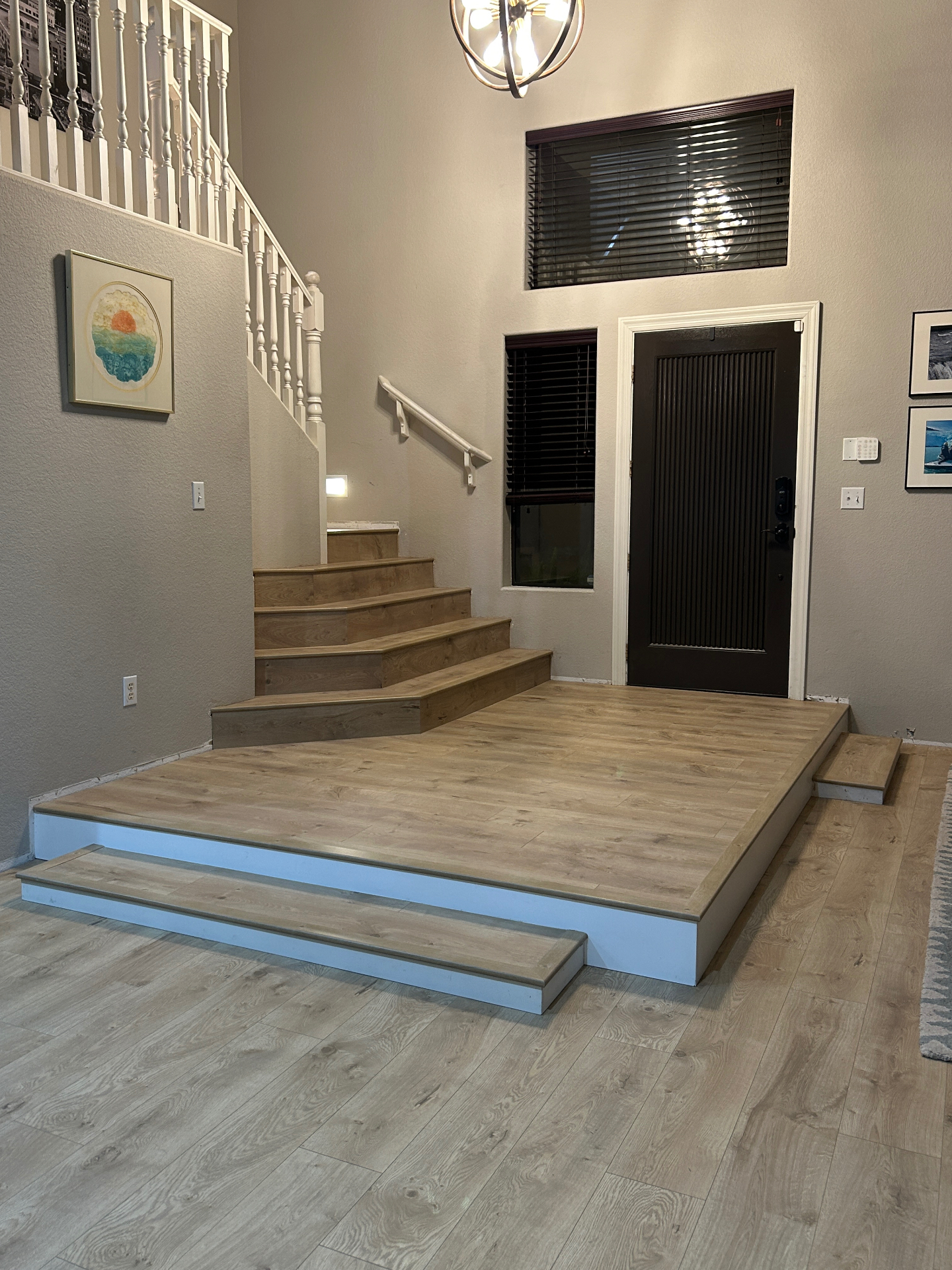 Entryway landing with LVP stairs